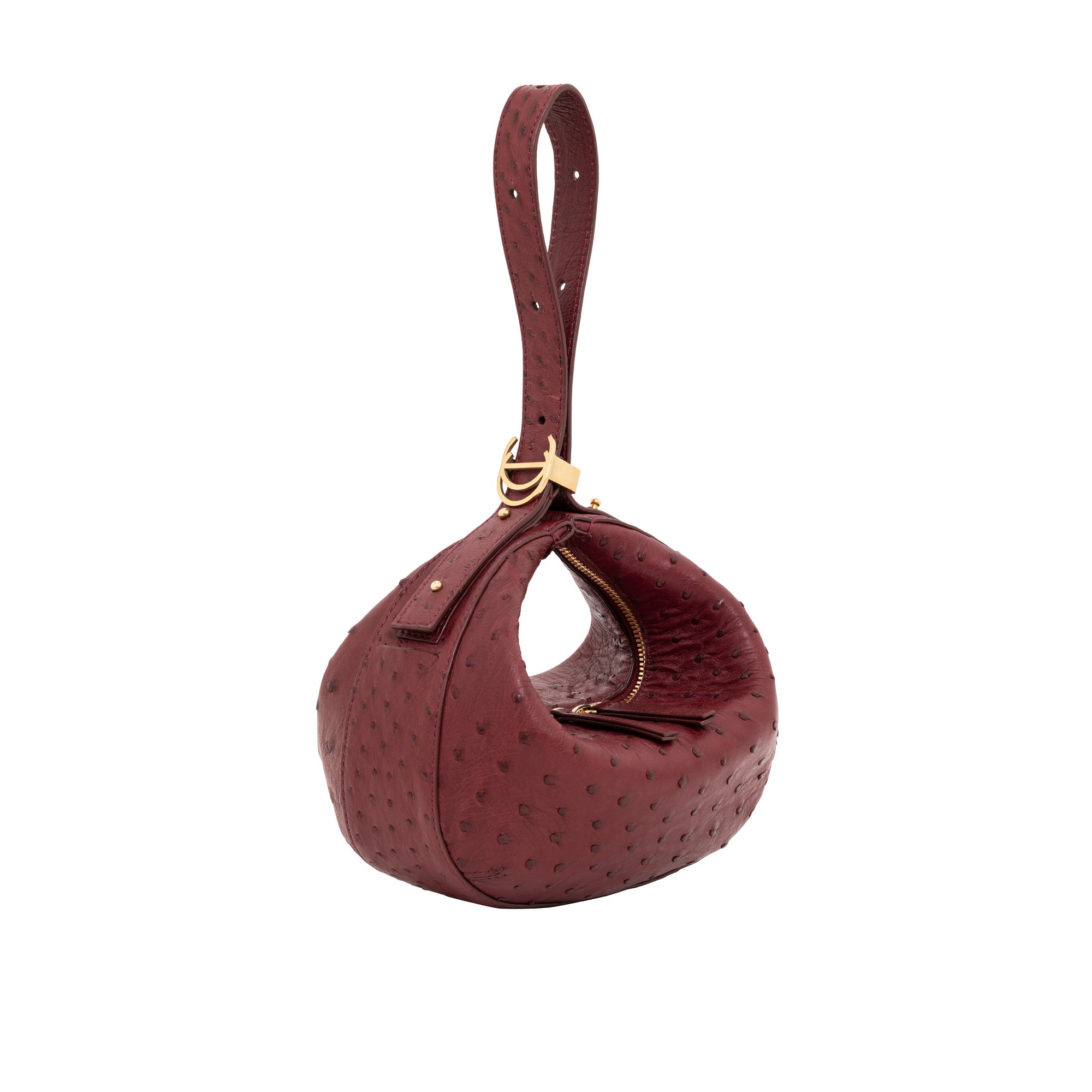 Maroon ostrich-textured handbag with gold zipper on a white background