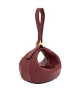 Maroon ostrich-textured handbag with gold zipper on a white background