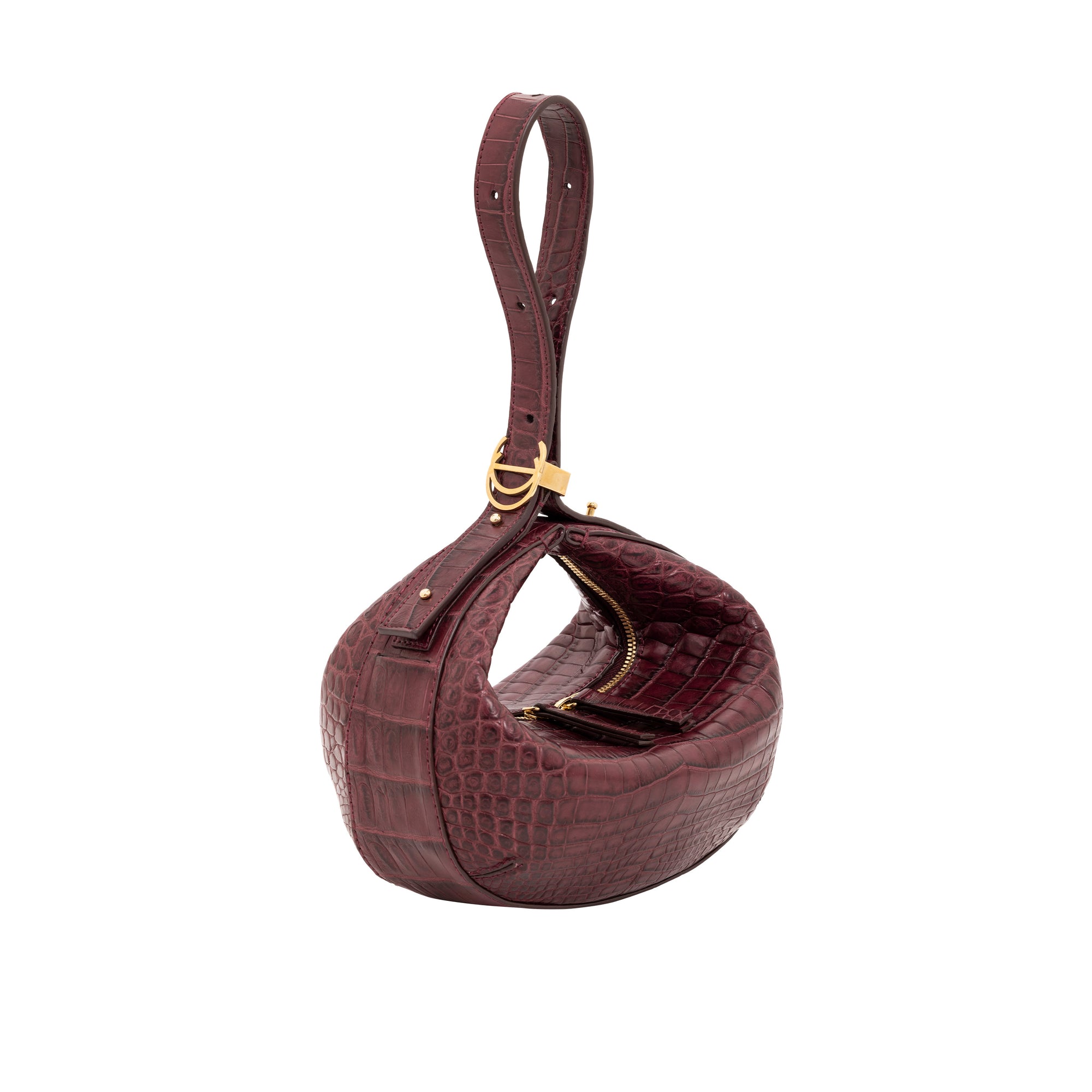 Maroon crocodile-patterned handbag with gold accents on a white background