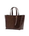 Dark brown semi suede-textured handbag on a white background