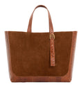 Cognac semi suede-textured handbag on a white background