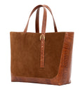 Cognac semi suede-textured handbag on a white background