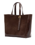 Brown semi suede-textured handbag on a white background