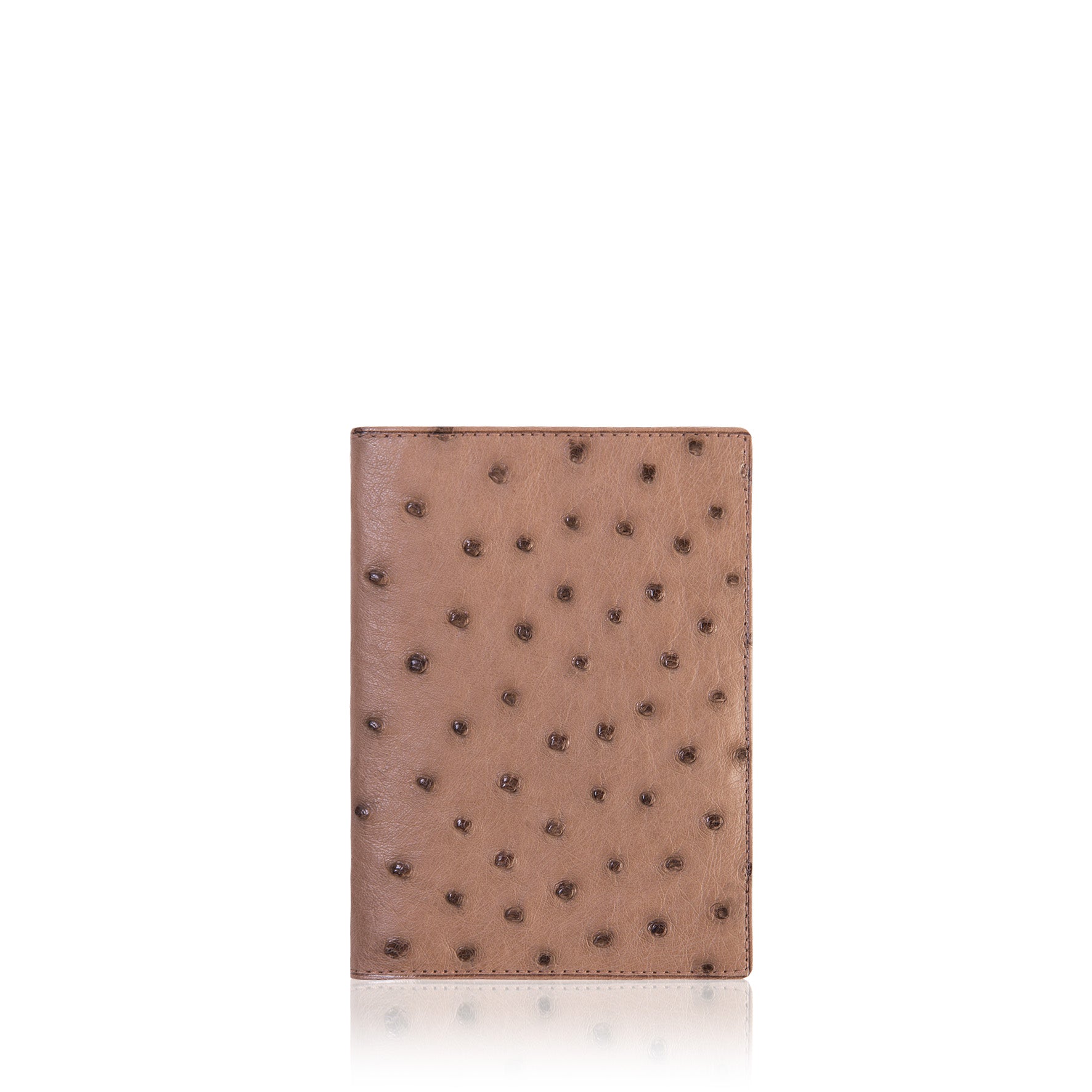 Brown leather wallet with black studs on a white background