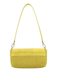 Back of a yellow woven handbag with a strap on a white background