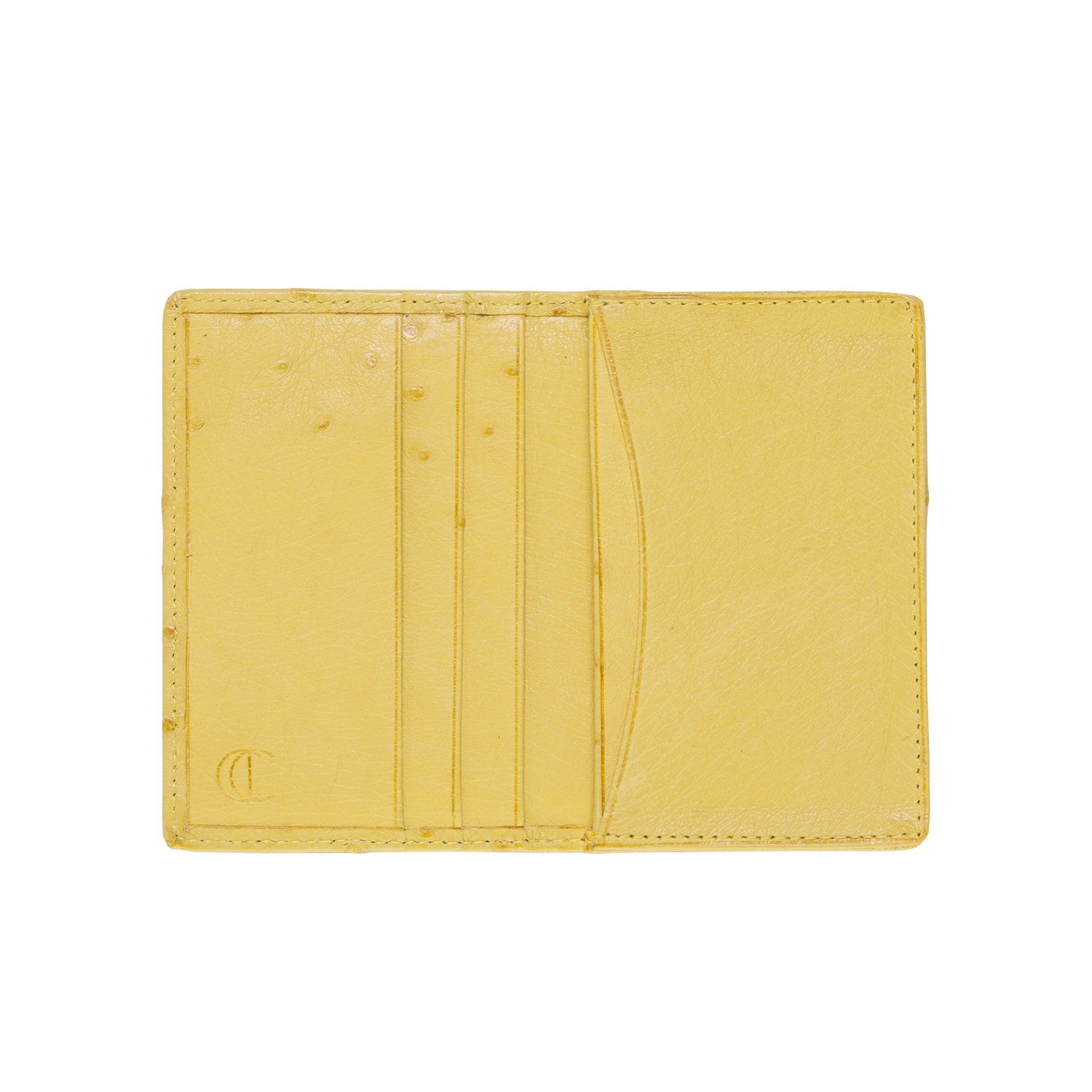 Inside of a yellow ostrich leather wallet on a white background