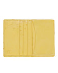 Inside of a yellow ostrich leather wallet on a white background