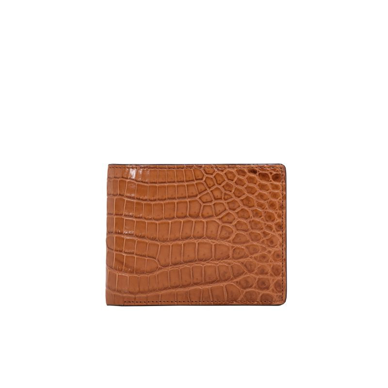 Brown crocodile-textured wallet on a white background