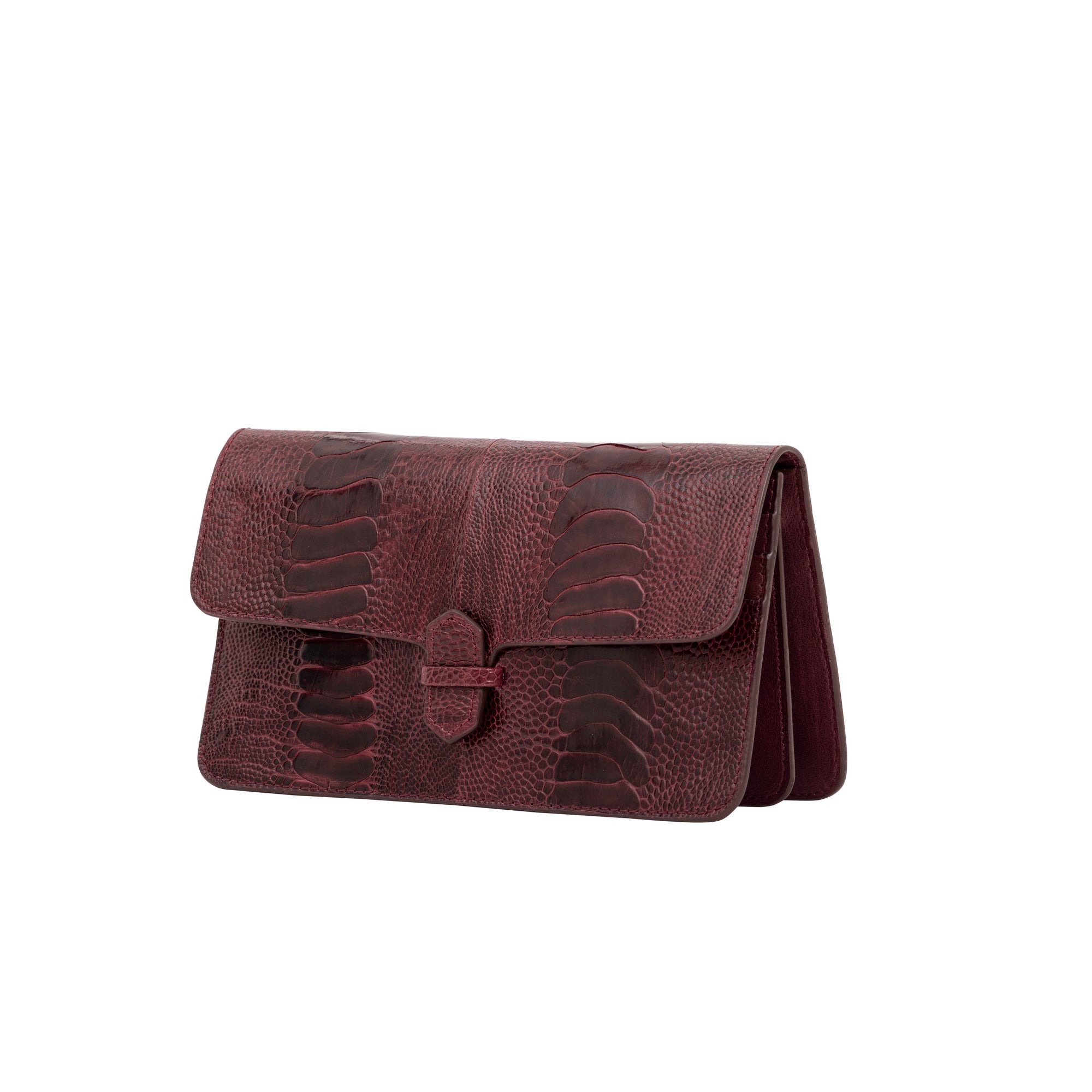 Burgundy textured clutch bag on a white background