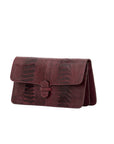 Burgundy textured clutch bag on a white background