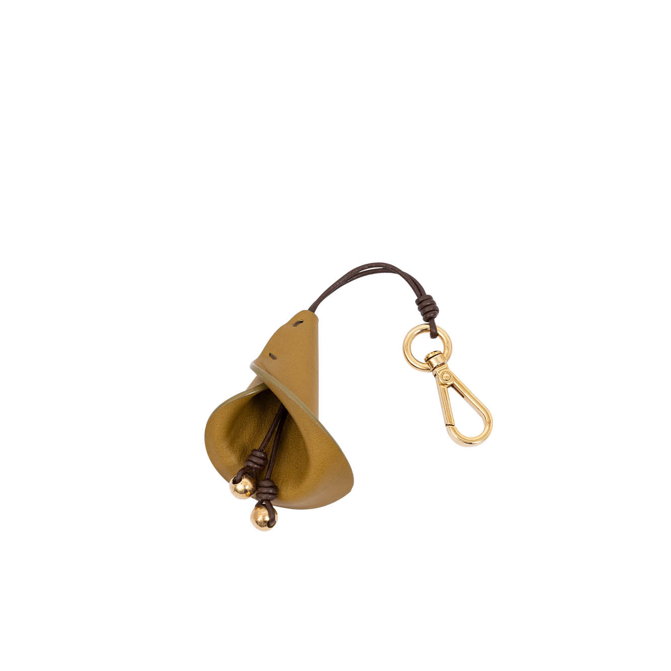 Gold bell with leather strap and keychain on a white background