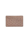 Back of a beige ostrich textured cardholder on a white background