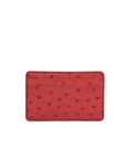 Back of a red ostrich textured cardholder on a white background